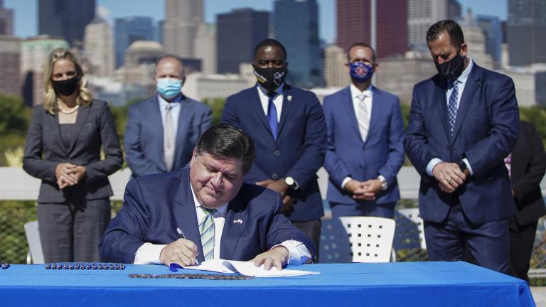 Illinois Governor J.B. Pritzker signs CEJA into law in Chicago.