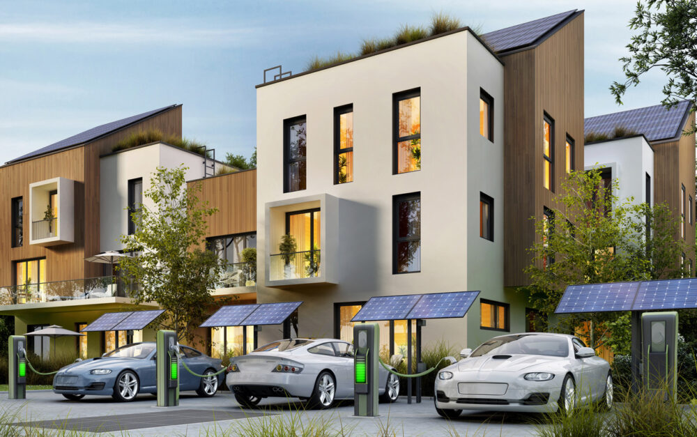 Modern apartment buildings and fast electric car charging stations